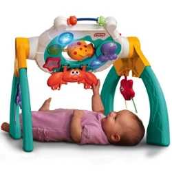 Развивающая музыкальная игрушка "Крабик" Маленький ребенок изучает музыкальную игрушку